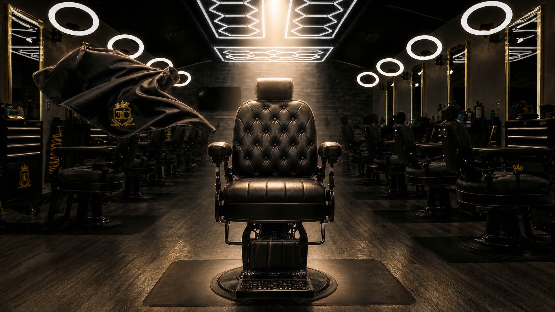 An empty barber chair under a cinematic spotlight inside Empire Cuts